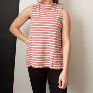 Pink and white striped turtleneck blouse